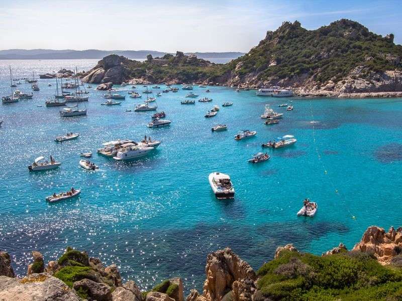 La Maddalena archipelago in Sardinia with yachts anchored in turquoise waters